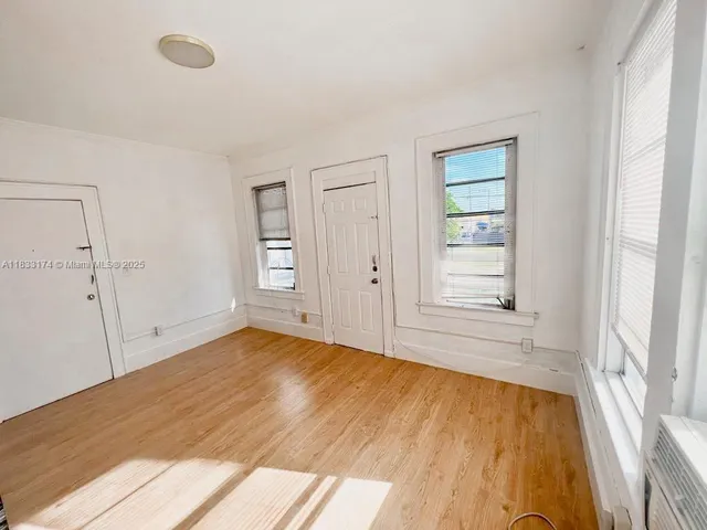 a view of an empty room with a window