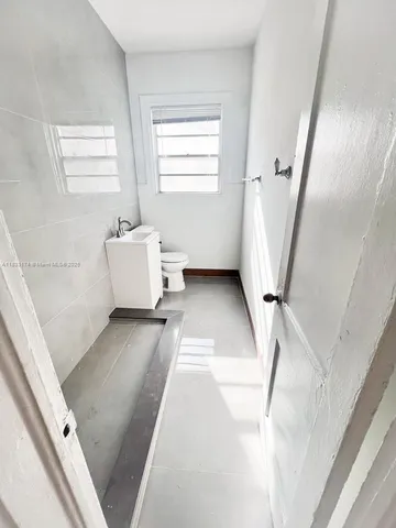 a bathroom with a sink and mirror