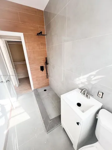 a picture of a wall with a white wall and a picture of a next to a wall