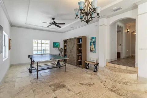 a view of a livingroom with furniture and a ceiling fan