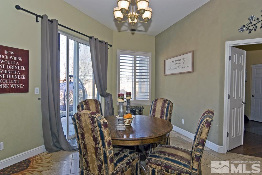 1795 Arrow Wood Court Reno, NV 89521 - Photo 15 of 40 a view of a dining room with furniture and window