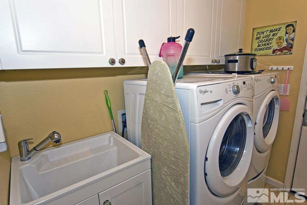 1795 Arrow Wood Court Reno, NV 89521 - Photo 17 of 40 a utility room with dryer and washer