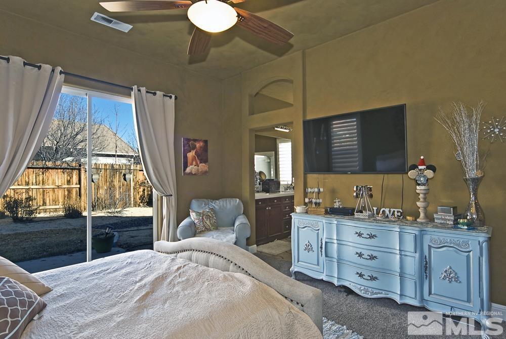 1795 Arrow Wood Court Reno, NV 89521 - Photo 20 of 40 a bedroom with a bed and a dresser