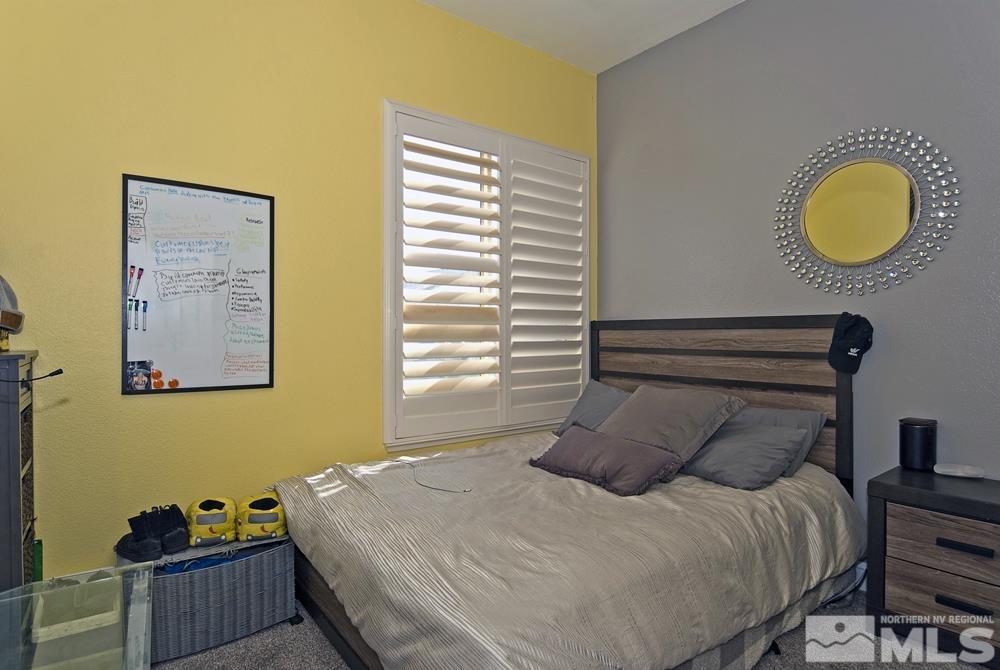 1795 Arrow Wood Court Reno, NV 89521 - Photo 25 of 40 a bedroom with a bed and a window