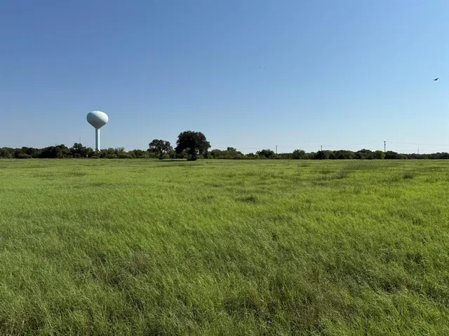 a view of a golf course with a lake