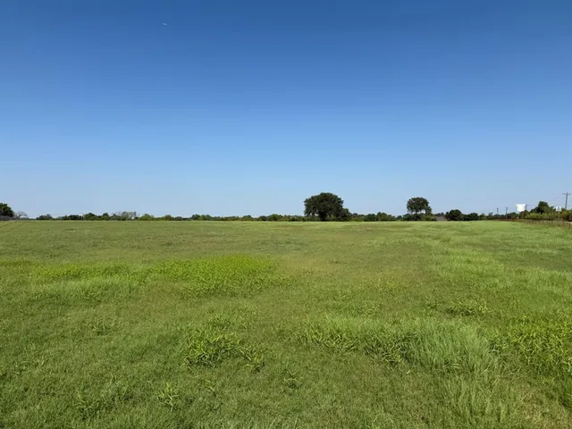 a view of a golf course with a road