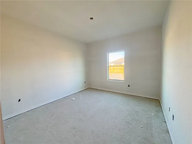 a white toilet sitting next to a shower