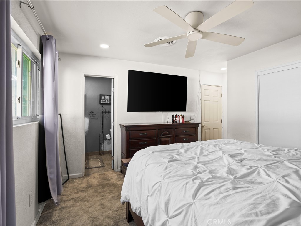 1455 North Alice Avenue Rialto, CA 92376 - Photo 20 of 23 a bedroom with a bed and a flat screen tv