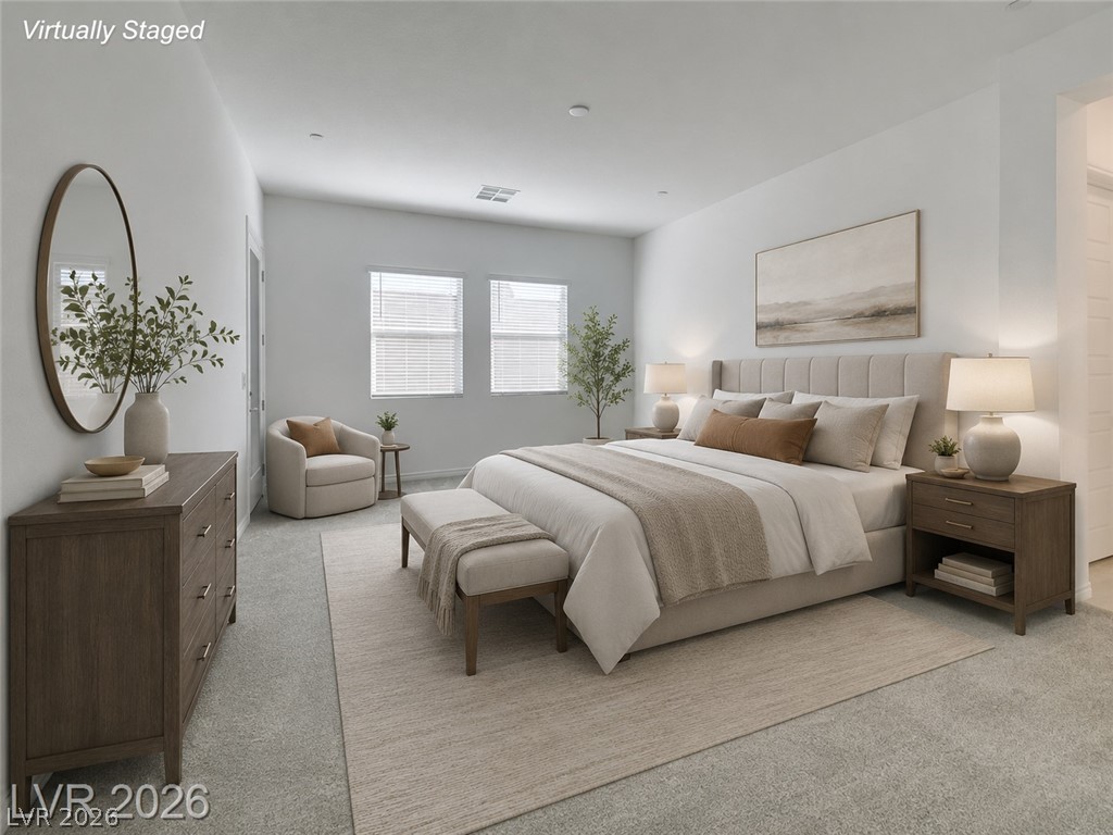 37 Charlotte Ridge Place Henderson, NV 89011 - Photo 2 of 44 A well-lit primary bedroom offers serene comfort with plush carpet and ample natural illumination. *Virtually Staged*