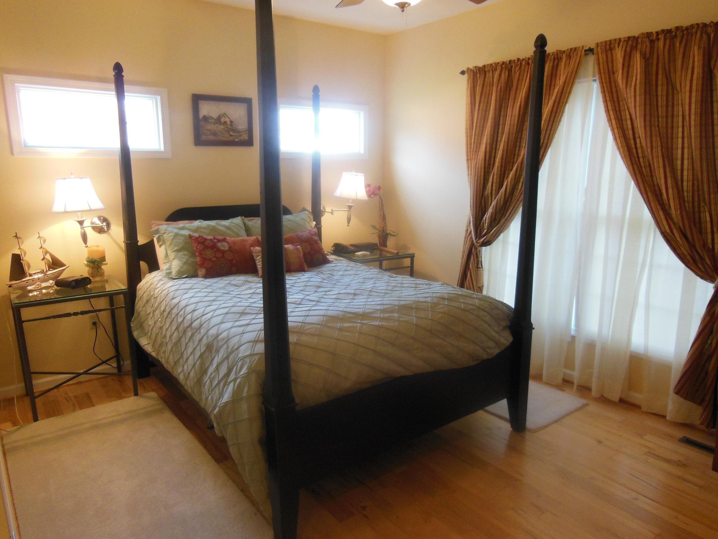 3370 Rakes Road Rocky Mount, VA 24151 - Photo 22 of 38 a bed sitting in a bedroom next to a window