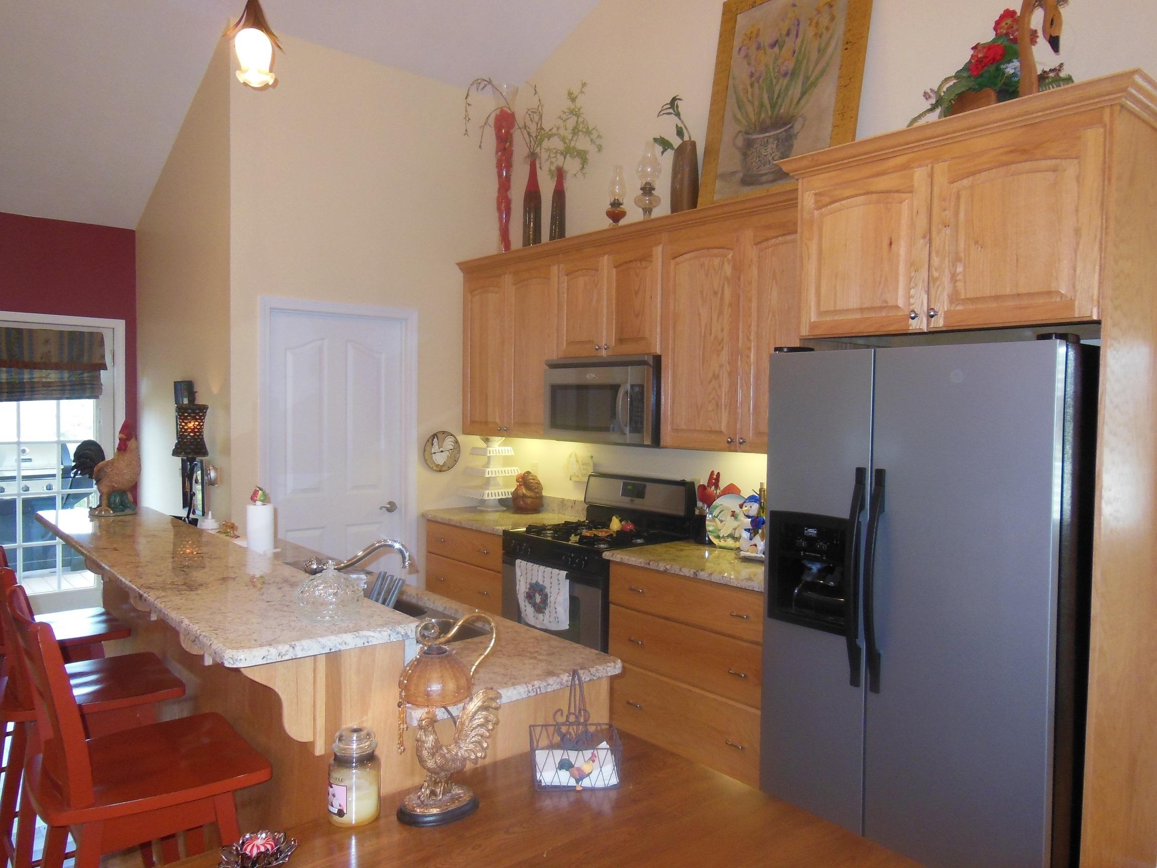 3370 Rakes Road Rocky Mount, VA 24151 - Photo 8 of 38 a kitchen with stainless steel appliances granite countertop a refrigerator a stove top oven a sink and dishwasher