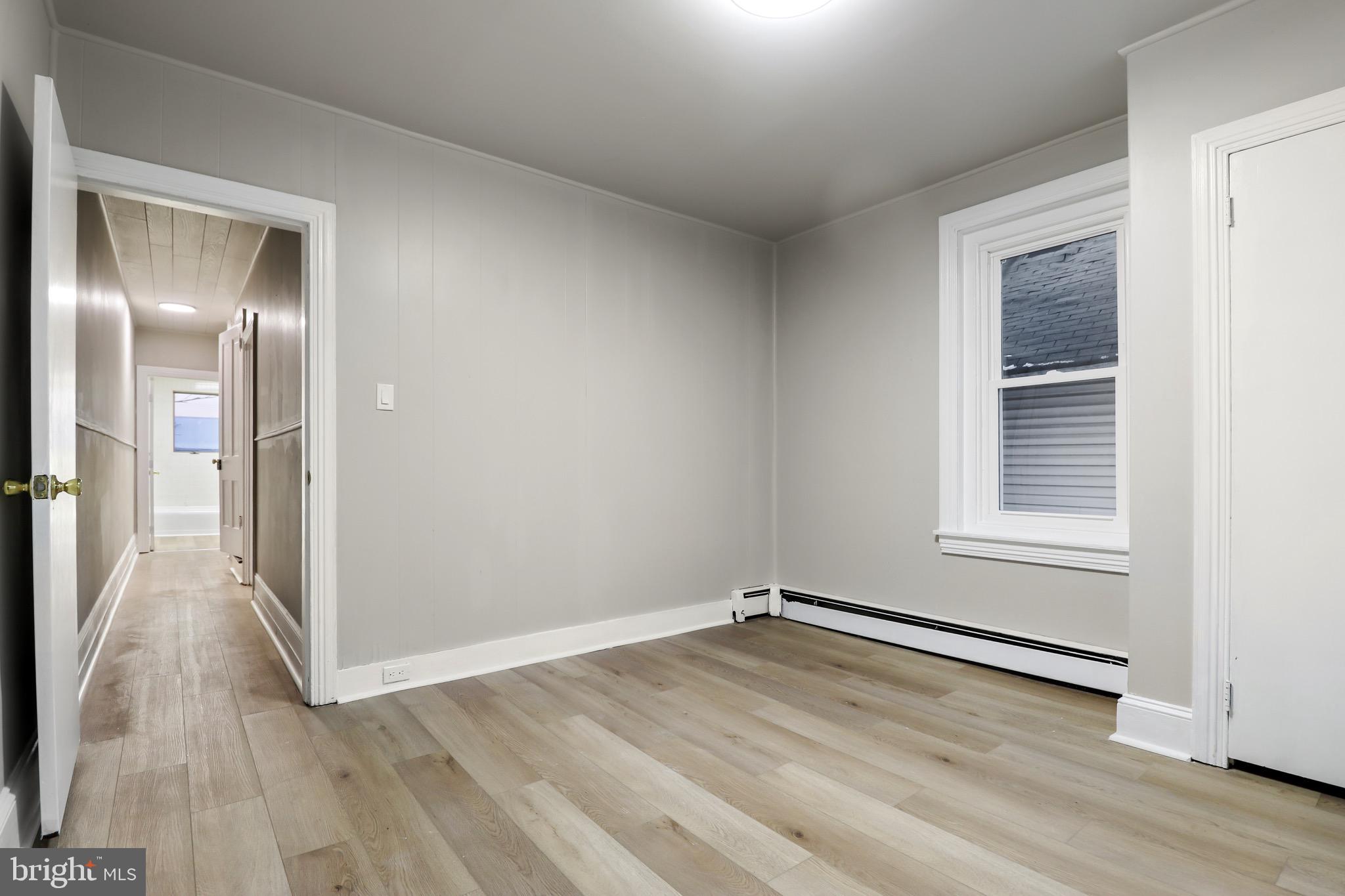 77 7th Street Salem, NJ 08079 - Photo 7 of 15 a view of a room with wooden floor and window