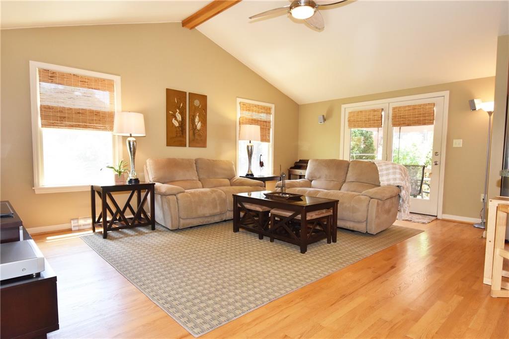 294 Old Farm Road Pittsburgh, PA 15228 - Photo 11 of 25 a living room with furniture and a flat screen tv with wooden floor