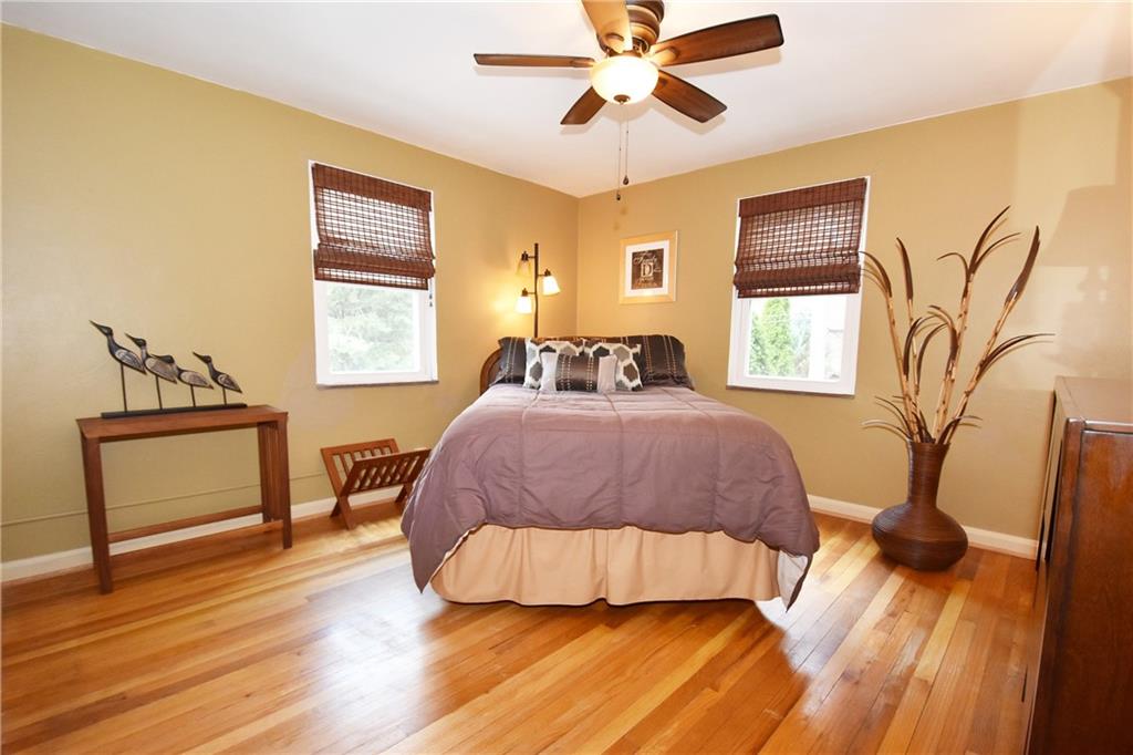 294 Old Farm Road Pittsburgh, PA 15228 - Photo 15 of 25 a bedroom with a bed and wooden floor
