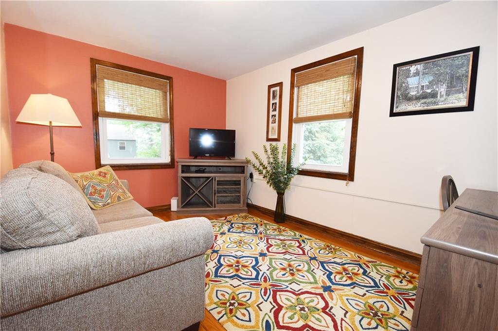 294 Old Farm Road Pittsburgh, PA 15228 - Photo 16 of 25 a living room with furniture a flat screen tv and a window