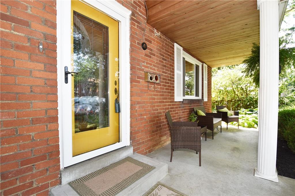 294 Old Farm Road Pittsburgh, PA 15228 - Photo 2 of 25 a view of a porch with chairs and potted plants
