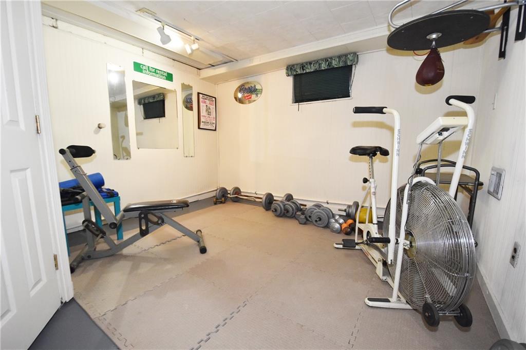 294 Old Farm Road Pittsburgh, PA 15228 - Photo 21 of 25 a room with gym equipment and view of living room