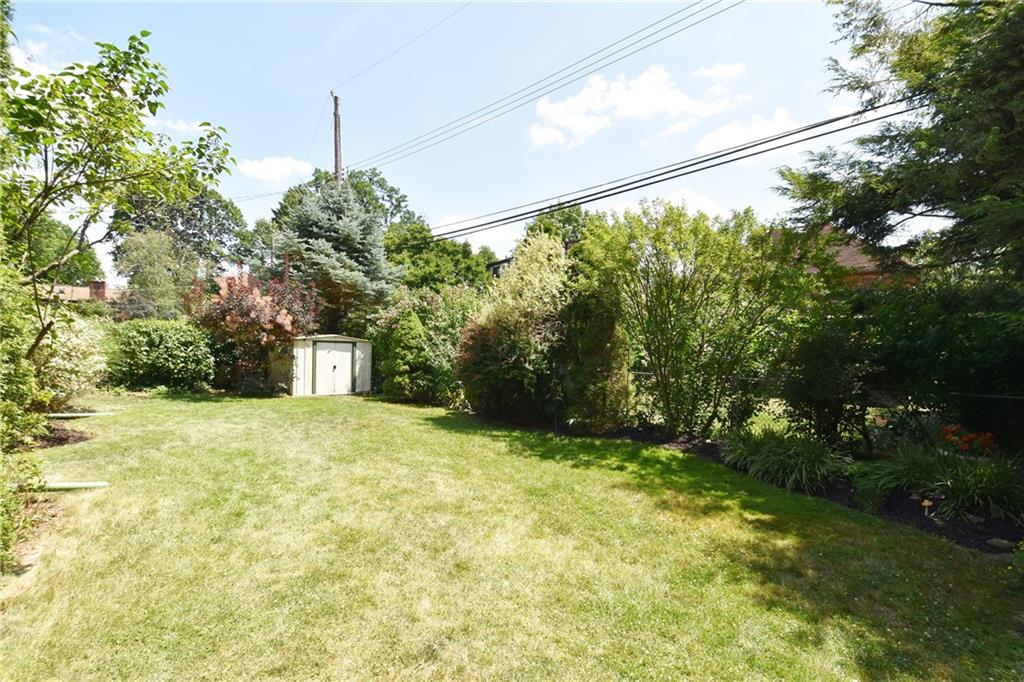 294 Old Farm Road Pittsburgh, PA 15228 - Photo 24 of 25 a yellow house with trees in front of it
