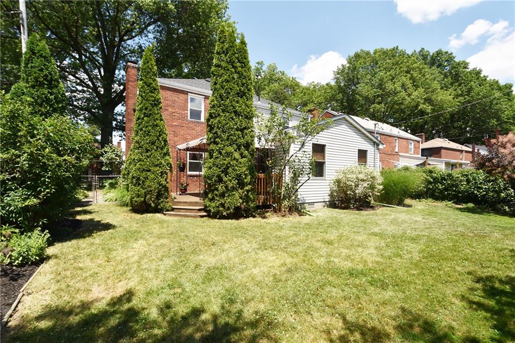 294 Old Farm Road Pittsburgh, PA 15228 - Photo 25 of 25 a yellow and red house covered with trees in the background
