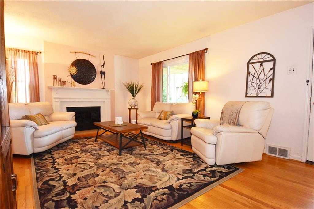 294 Old Farm Road Pittsburgh, PA 15228 - Photo 3 of 25 a living room with couches rug and a fireplace