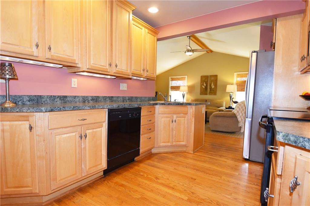 294 Old Farm Road Pittsburgh, PA 15228 - Photo 8 of 25 a kitchen with a sink cabinets and wooden floor