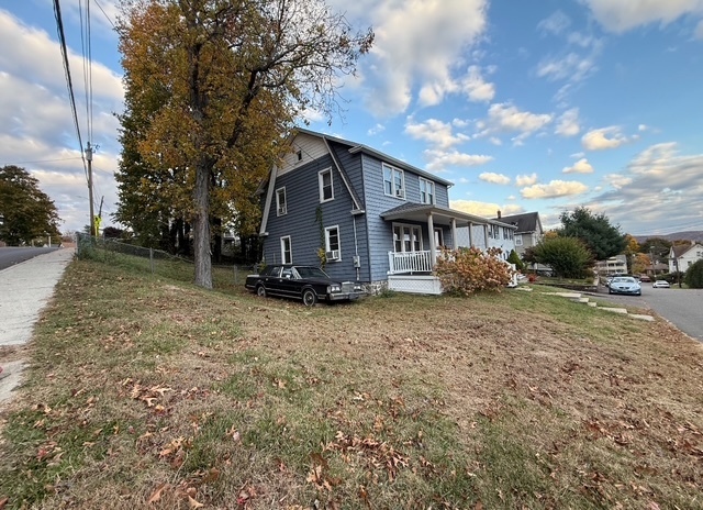 43 Marshall Avenue Naugatuck, CT 06770 - Photo 3 of 11 a house with trees in the background