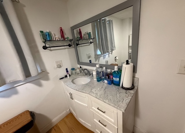 43 Marshall Avenue Naugatuck, CT 06770 - Photo 7 of 11 a bathroom with a granite countertop sink and a mirror