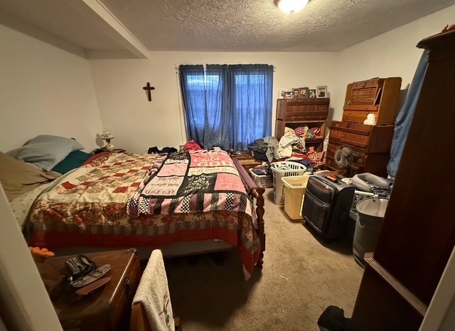 43 Marshall Avenue Naugatuck, CT 06770 - Photo 9 of 11 a bedroom with a bed and wooden furniture