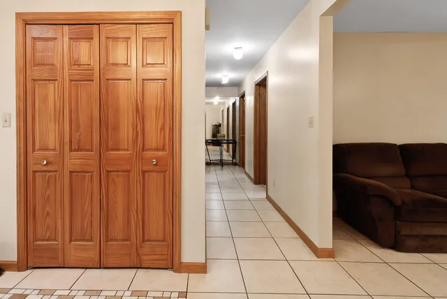a spacious bedroom with a bed and a window
