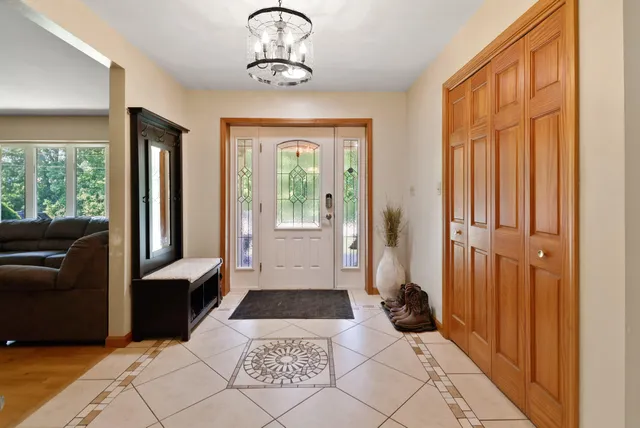 a view of a entryway door and hallway with furniture