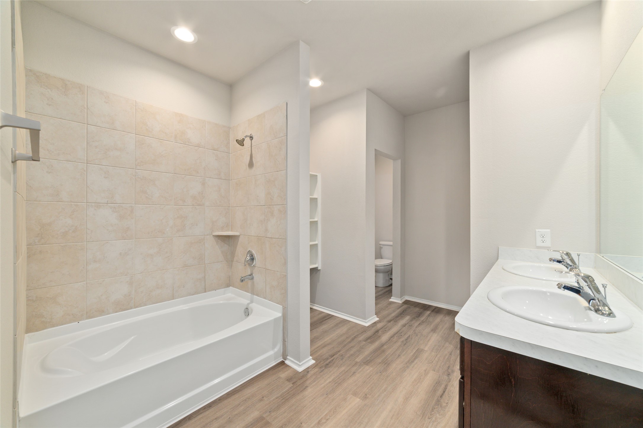 23702 Harrow Field Ln Spring Spring, TX 77373 - Photo 18 of 32 a bathroom with a bathtub and a sink