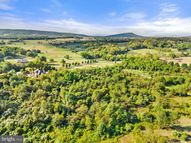 a view of a large body of water with a building in the background