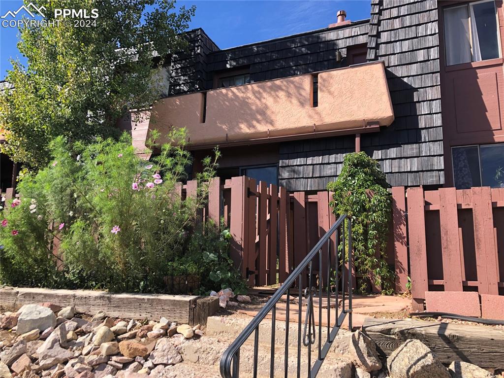 2953 Mesa Road, Unit B Colorado Springs, CO 80904 - Photo 12 of 17 a view of entryway with a tree