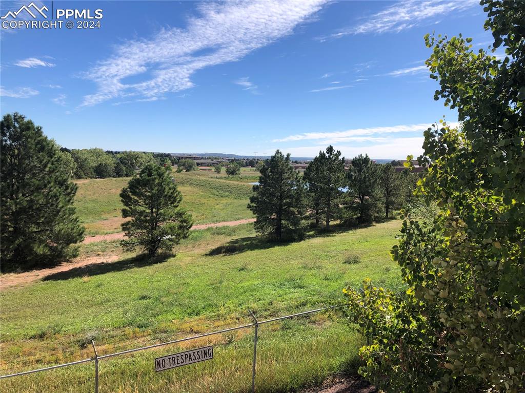 2953 Mesa Road, Unit B Colorado Springs, CO 80904 - Photo 15 of 17 a view of a lake with a yard