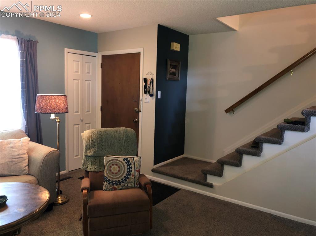 2953 Mesa Road, Unit B Colorado Springs, CO 80904 - Photo 2 of 17 a view of a livingroom with furniture and stairs