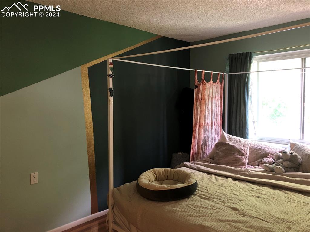 2953 Mesa Road, Unit B Colorado Springs, CO 80904 - Photo 8 of 17 a bathroom with a granite countertop sink and a mirror