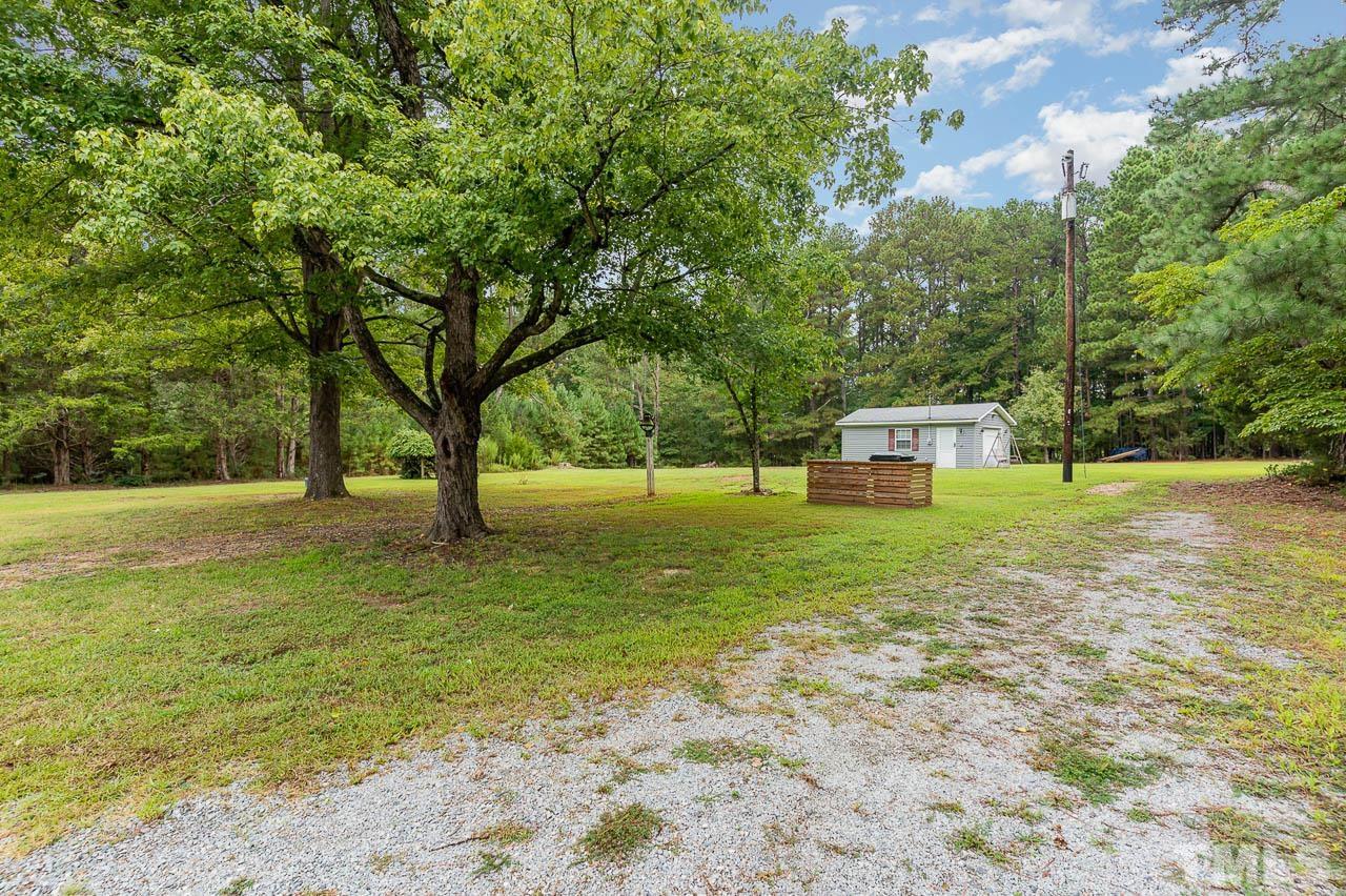 821 Snow Hill Road Durham, NC 27712 - Photo 15 of 15 a house view with a garden space