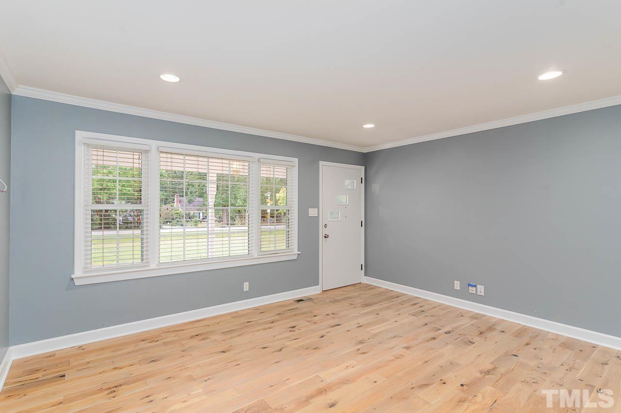 821 Snow Hill Road Durham, NC 27712 - Photo 5 of 15 a view of empty room with wooden floor