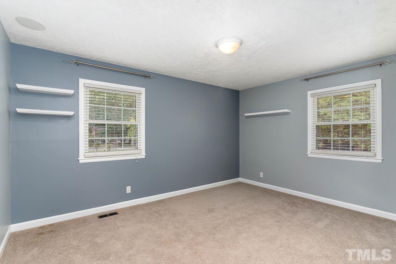 821 Snow Hill Road Durham, NC 27712 - Photo 10 of 15 an empty room with a window