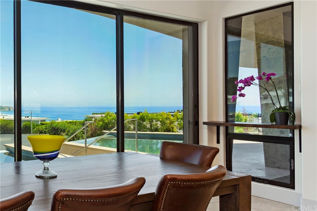50 Monarch Bay Drive Dana Point, CA 92629 - Photo 11 of 34 a view of a swimming pool with a lounge chair