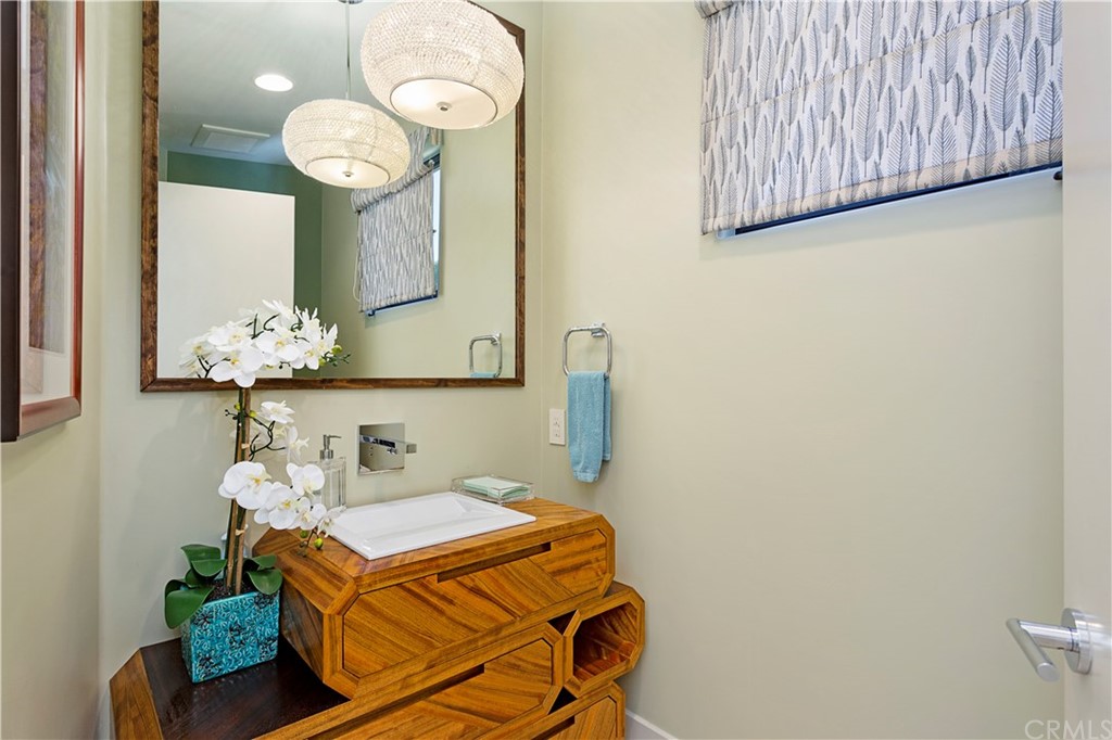 50 Monarch Bay Drive Dana Point, CA 92629 - Photo 14 of 34 a bathroom with a sink mirror and vanity