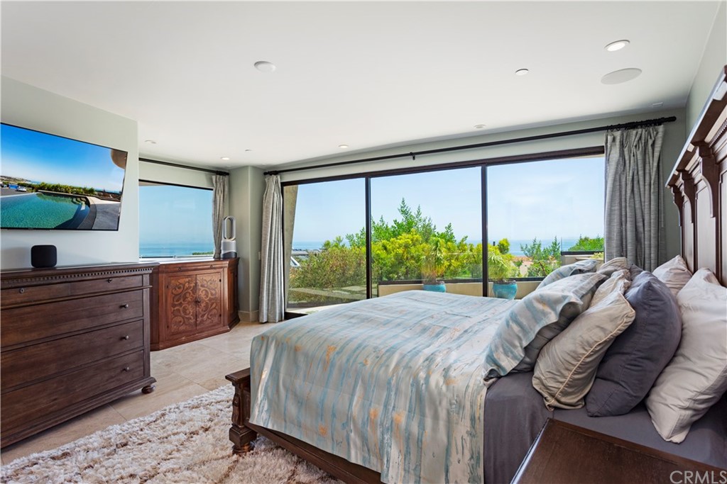 50 Monarch Bay Drive Dana Point, CA 92629 - Photo 15 of 34 a bed room with a bed and a large window