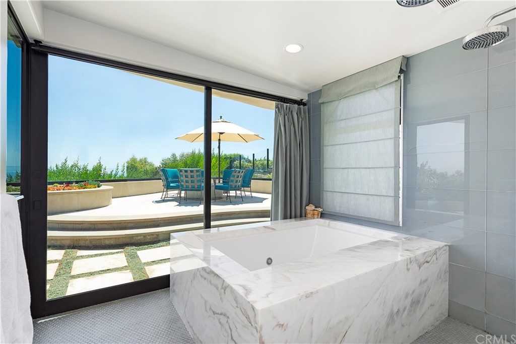 50 Monarch Bay Drive Dana Point, CA 92629 - Photo 16 of 34 a living room with a large window and a table