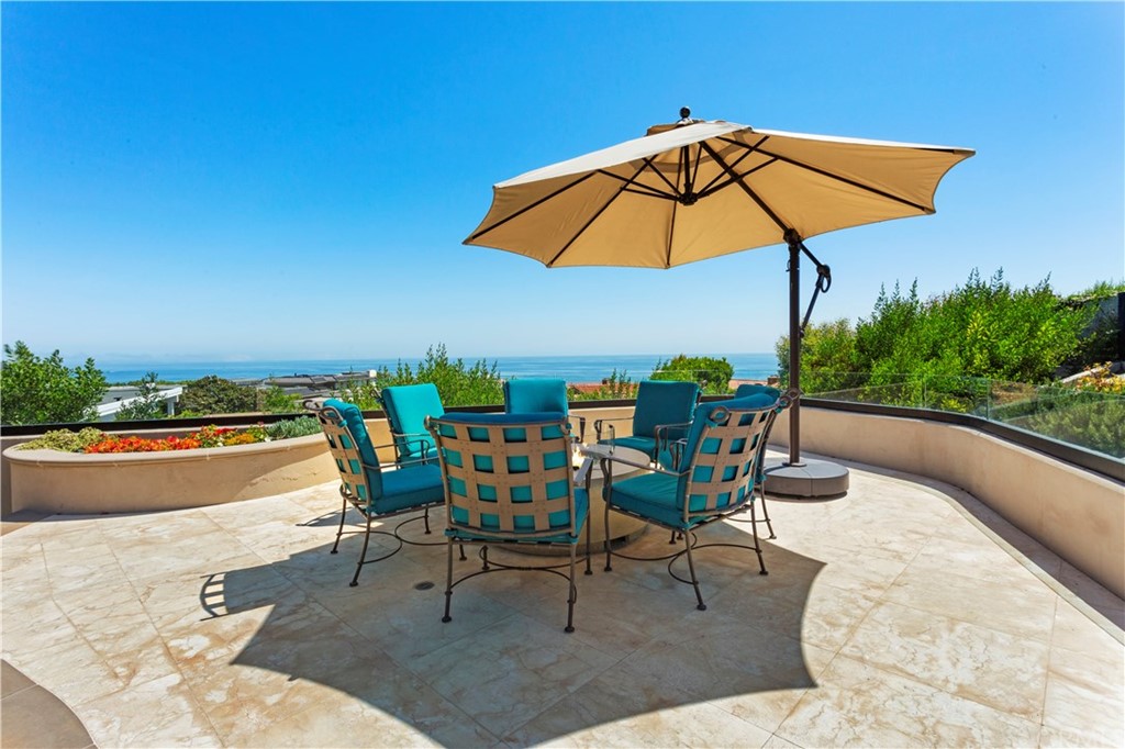 50 Monarch Bay Drive Dana Point, CA 92629 - Photo 17 of 34 a view of a swimming pool with chairs and table