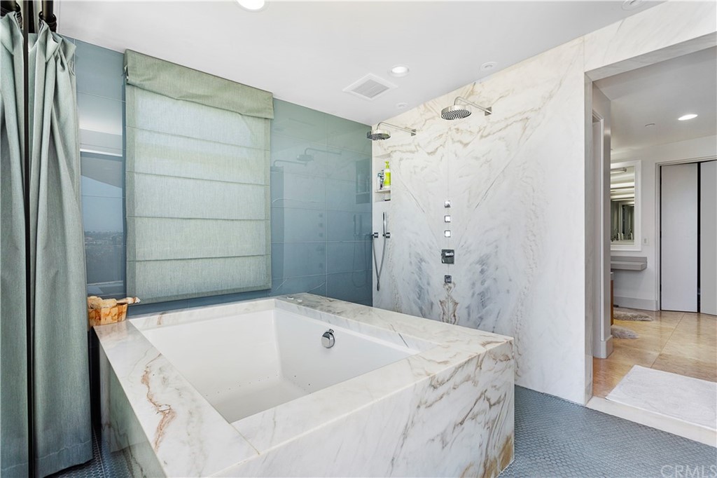 50 Monarch Bay Drive Dana Point, CA 92629 - Photo 20 of 34 a bathroom with a tub and shower