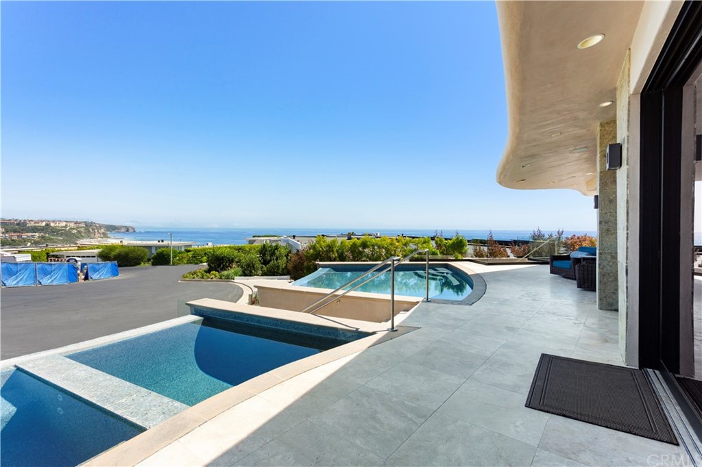 50 Monarch Bay Drive Dana Point, CA 92629 - Photo 2 of 34 a view of swimming pool with seating area and ocean view