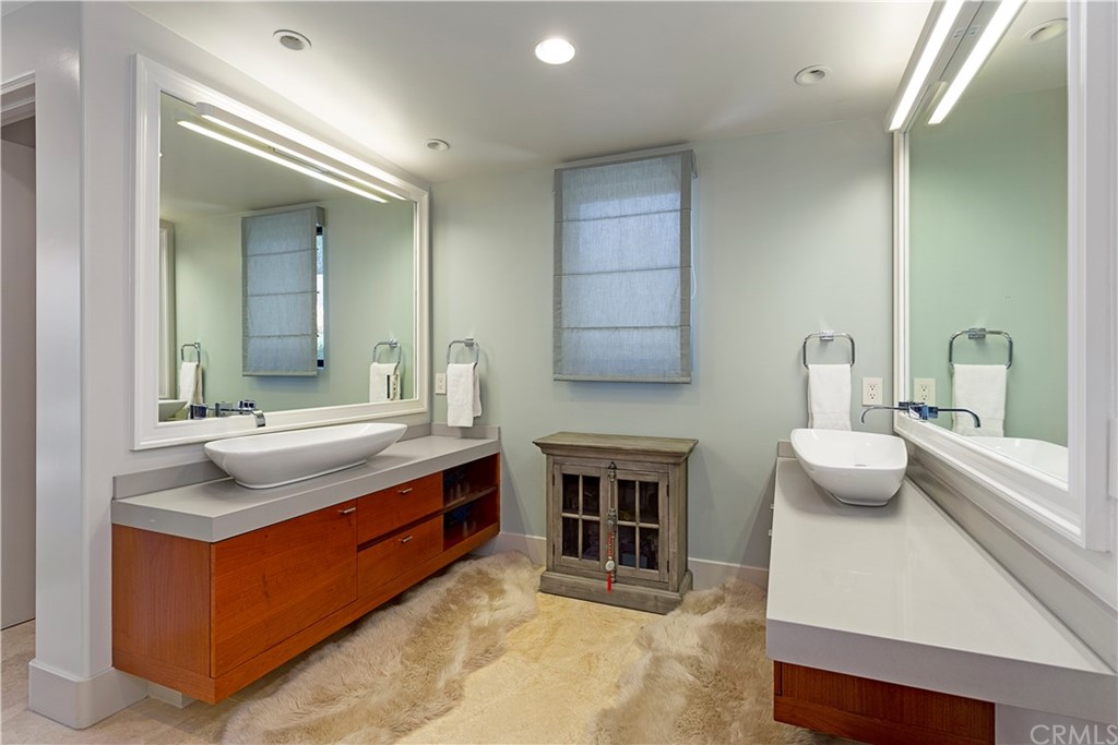 50 Monarch Bay Drive Dana Point, CA 92629 - Photo 21 of 34 a bathroom with a granite countertop sink and a mirror