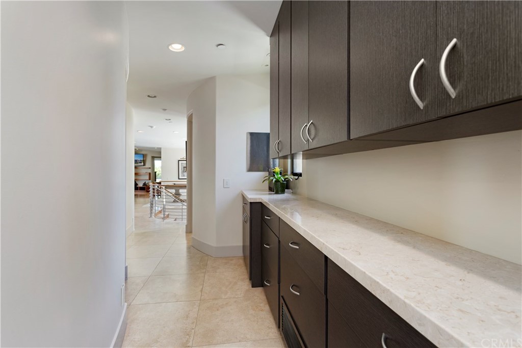 50 Monarch Bay Drive Dana Point, CA 92629 - Photo 22 of 34 a kitchen with a sink and cabinets