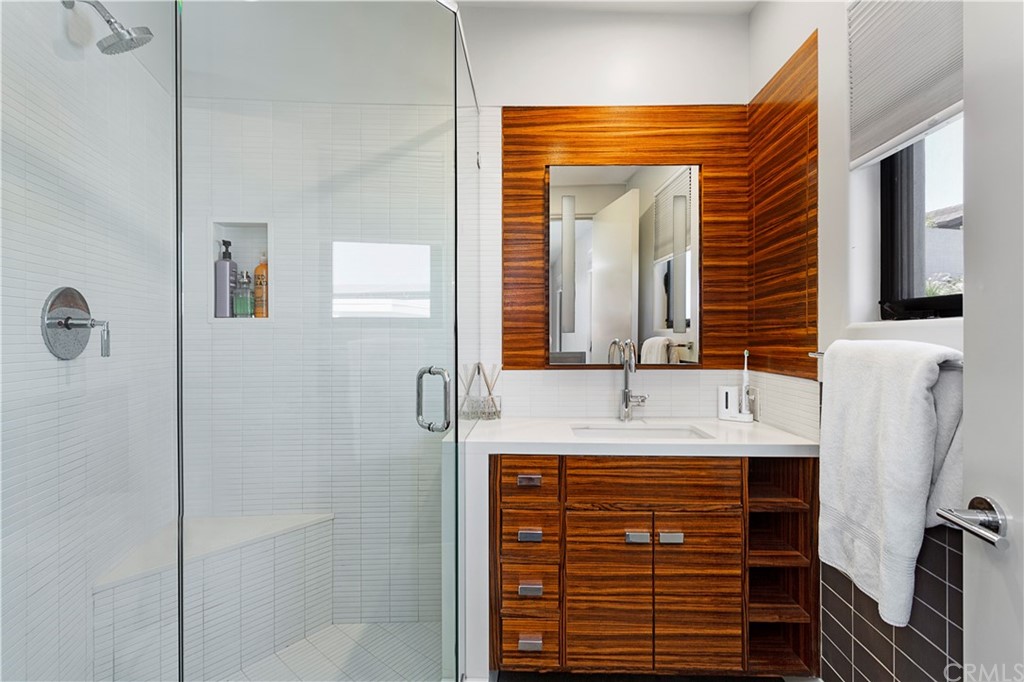 50 Monarch Bay Drive Dana Point, CA 92629 - Photo 23 of 34 a bathroom with a sink and a mirror
