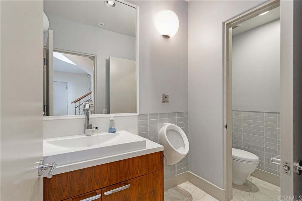 50 Monarch Bay Drive Dana Point, CA 92629 - Photo 29 of 34 a bathroom with a sink toilet and shower